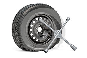 Punctured car wheel with cross wrench