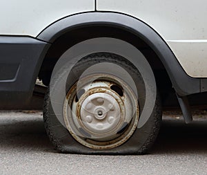 Punctured wheel of a small car