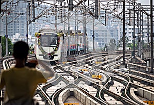 Pune metro train approaching station , on its inaugural run.