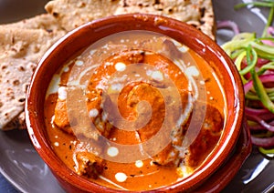 Punjabi Chicken Curry meal with roti and salad