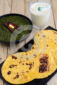 Punjabi meal-Sarso saag(greens) served with Indian maize(makka) flat bread