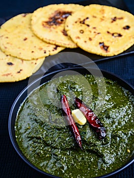 Punjabi meal-Sarso saag(greens) served with Indian maize(makka) flat bread