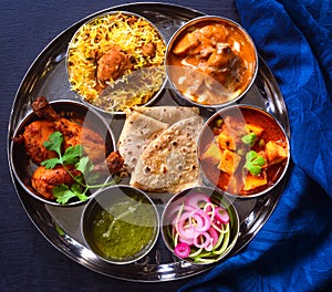 Indian non-vegetarian Meal -Butter Chicken, rajma, biryani with roti and salad