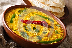 Punjabi recipe Dal Tadka vegetarian yellow lentils with spices s