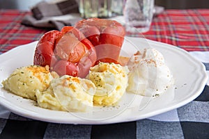 Stuffed peppers plate served with mashed potatoes and cream cheese called Kajmak photo