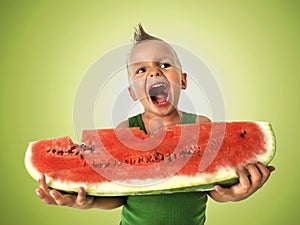 Punk boy eating a big slice of watermelon
