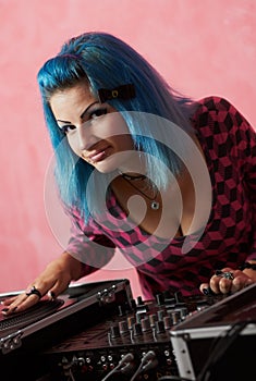Punk girl DJ with dyed blue hair