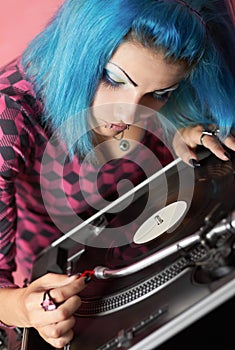 Punk girl DJ with dyed turqouise hair