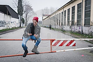 Punk guy posing in the city streets