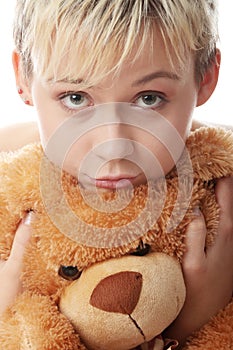 Punk teen girl with teddy bear