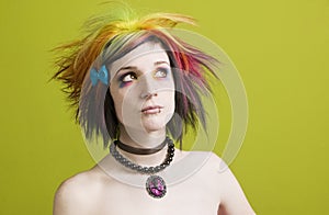 Punk woman with bright makeup and bare shoulders