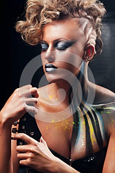 Punk woman posing with closed eyes portrait