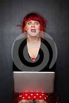 Punky Girl with Red Hair with Laptop Computer