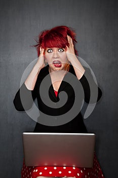 Punky Girl with Red Hair with Laptop Computer