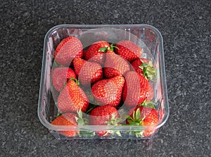 Punnet of fresh ready to eat strawberries