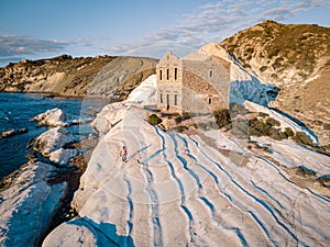 Punta Bianca, Agrigento in Sicily Italy White beach with old ruins of abandoned stone house on white cliffs photo