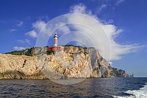 Punta Carena Lighthouse on the coastal rocks in Capri island