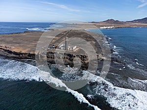 Caleta del bajo, corralejo grandes playas white sandy beach with blue water near Corralejo touristic town on north of photo