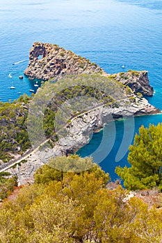 Punta de Sa Foradad and boats at gulf in Mallorca, Spain