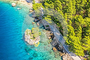 Punta Rata beach in Brela, Croatia, aerial view. Adriatic Sea with turquoise clean water and white sand on the beach photo