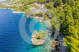 Punta Rata beach in Brela, Croatia, aerial view. Adriatic Sea with turquoise clean water and white sand on the beach photo