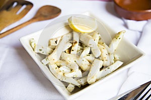 Puntas de calamar al ajillo. Grilled squid tips with garlic. Traditional Spanish tapa.