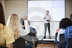 Pupil Asking Question During Presentation By High School Teacher