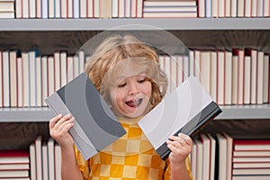 Pupil read book. Knowledge and education school concept. School boy pupil reading book in library. Kids learn to read