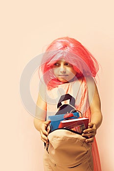 Pupil with scared face expression, isolated on light pink background