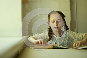 Pupil in school uniform with braids. Back to school and education concept