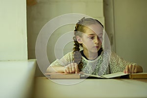 Pupil in school uniform with braids. Back to school and education concept