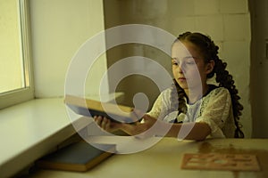 Pupil in school uniform with braids. Back to school and education concept