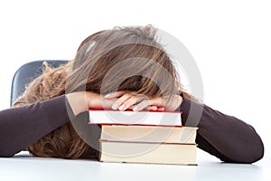 Pupil sleeping on her books