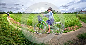 Pupils cycling to school on dirt roads