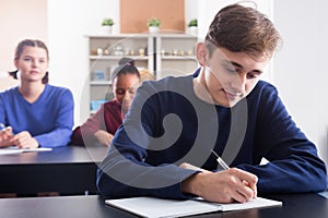 Pupils listening attentively teacherâ€™s explanations