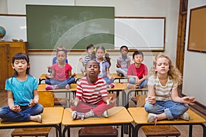 Pupils meditating in img