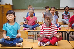 Pupils meditating in img