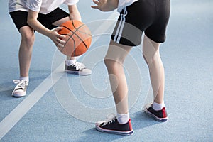Pupils playing basketball