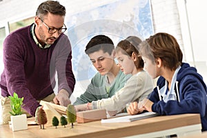 Pupils and teacher in classroom photo