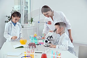 Pupils with their teacher at chemistry lesson