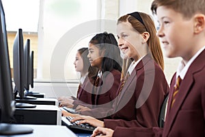 Pupils Wearing School Uniform In Computer Class