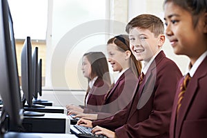 Pupils Wearing School Uniform In Computer Class