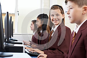 Pupils Wearing School Uniform In Computer Class