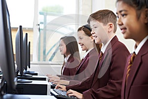 Pupils Wearing School Uniform In Computer Class