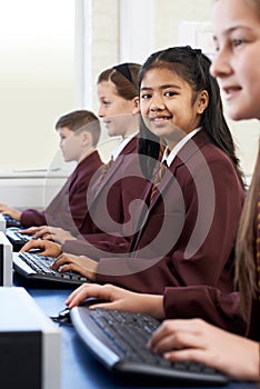 Pupils Wearing School Uniform In Computer Class