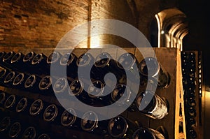 Pupitre and bottles in an underground cellar