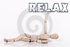 Puppet laying at ground, with its right arm up