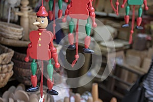 Puppet pinocchio made of wood. Store selling wooden handmade products. filmed in front of him