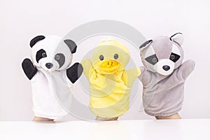 puppet theater on a white background. friendly animals hold hands. The concept of playing with children, friendship,