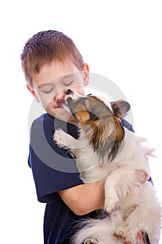 Puppy licking child face